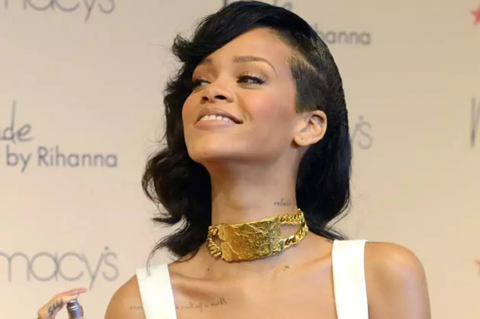 Rihanna Plays It Safe in White Dress, Rocks Statement Gold Necklace at Nude Fragrance Launch